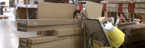 Justin hiding behind many IKEA boxes